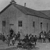 Students and teachers outside the Vicksburg Church School (Miss.) school room and chapel about 1900