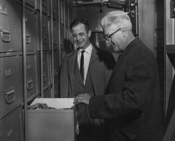 Seventh-day Adventist Community Services members look at a box of materials available to those people in need