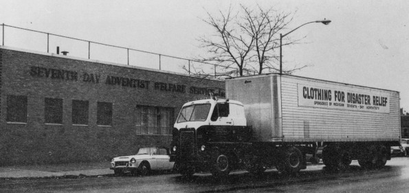 Seventh-day Adventist Welfare Services, Inc., moving van in front of the New York City warehouse
