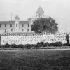 Paradise Valley Sanitarium nurses and other staff, 1919, with part of the building