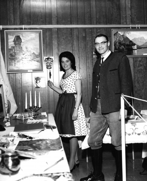 Man and woman from Germany or Switzerland display objects as part of the World Mission Exhibit at Andrews University Feb. 21 thru Mar. 1, 1967