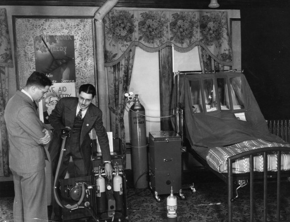Hinsdale Sanitarium and Hospital staff member demonstrates oxygen equipment