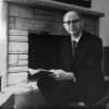 Andrews University president Richard L Hammill posing beside the fireplace