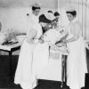 Battle Creek Sanitarium nurses practice a treatment, 1898