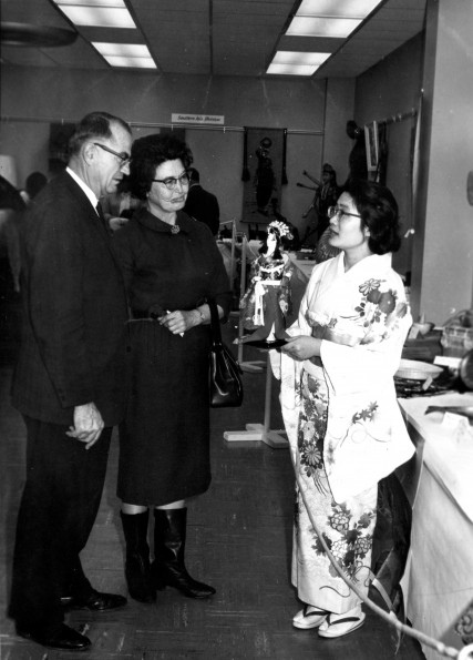 Woman from Asia in native dress chats with visitors as part of the World Mission Exhibit at Andrews University Feb. 21 thru Mar. 1, 1967