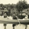 Three unknown people pleasure boating