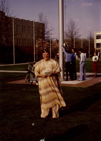 Andrews University president Joseph Grady Smoot under the American Flag pole behind Pioneer Memorial Church