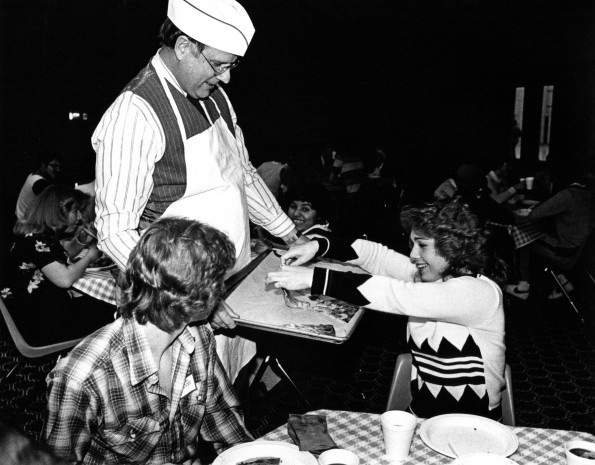 Andrews University president Joseph Grady Smoot serving students pizza