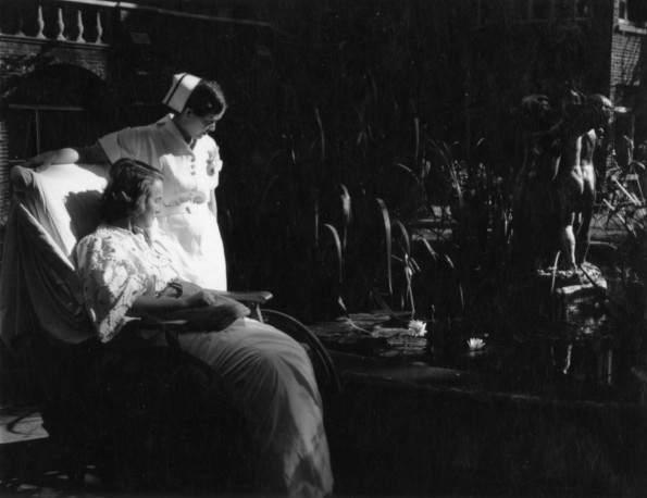 Hinsdale Sanitarium and Hospital patient and her nurse enjoying the Sanitarium grounds