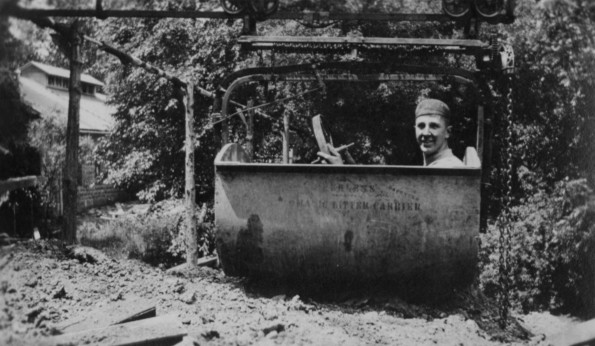 Man in a mechanical litter carrier