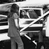 Penny Rusk, Liz Venden and Jud Nelson examins a plane landed on the athletic field and displayed in front of Alvin Johnson Auditorium during Andrews University registration day