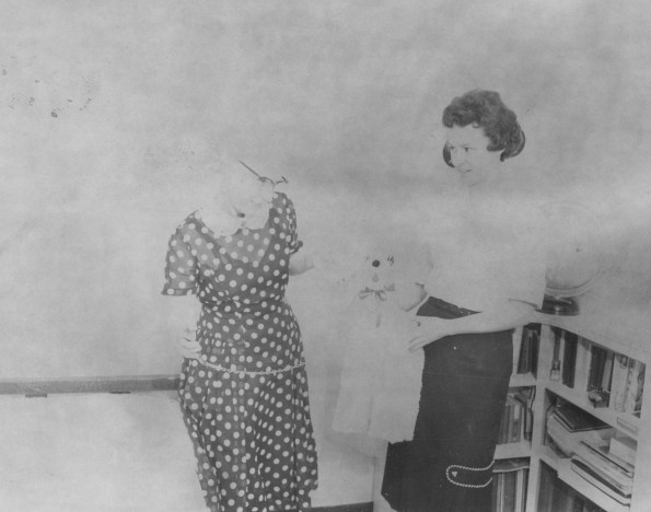 Andrews University assistant dean of women Mildred Rapson Martin recieves a toy dog gift