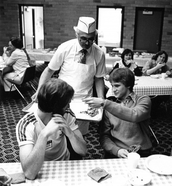 Richard W Schwarz serving student pizza