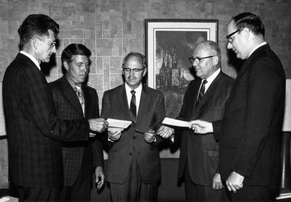 Andrews University president Richard L. Hammill with four vice presidents participate in buying shares in the proposed Action Ambulance Service to be stationed at Berrien Springs