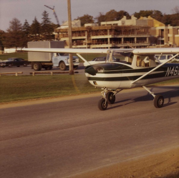 A plane taking off from a run way in front of the science complex at Andrews University