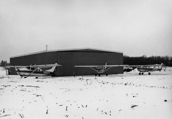 Three planes parked at the Andrews University airport at winter