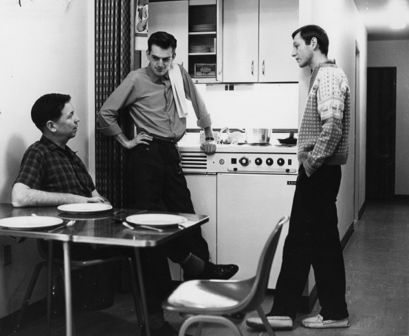 Niels-Erik Andreasen, Palle Olsen, and an unknown person in the Andrews University Garland Apartments