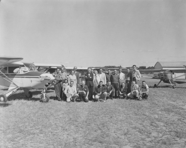 Andrews University flying club members with their planes