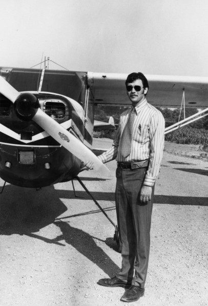 Andrews University flying student missionary Dan Wenberg in front of a plane