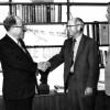 Andrews University president Richard L Hammill hand shaking with J Edward Hutchinson