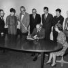 Andrews University president Richard L Hammill engraving the ground breaking shovel while unknown others look on