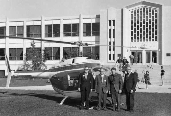 Bell Jet Ranger helicopter landed with participants at the Andrews University council fly-in in front of the James White Library at Andrews University
