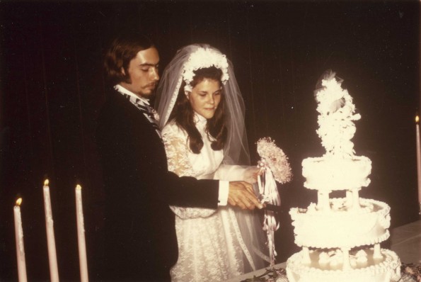 Marcia Joan Hammill and her husband cutting the wedding cake
