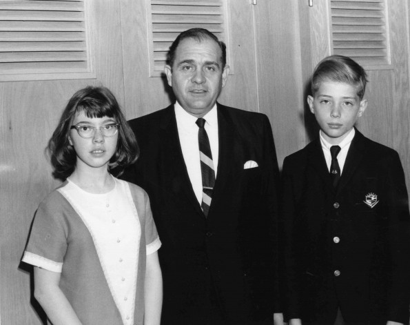 [Anthony Castelbuono with his newly baptized children]