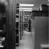 [Library stacks at the James White Library]