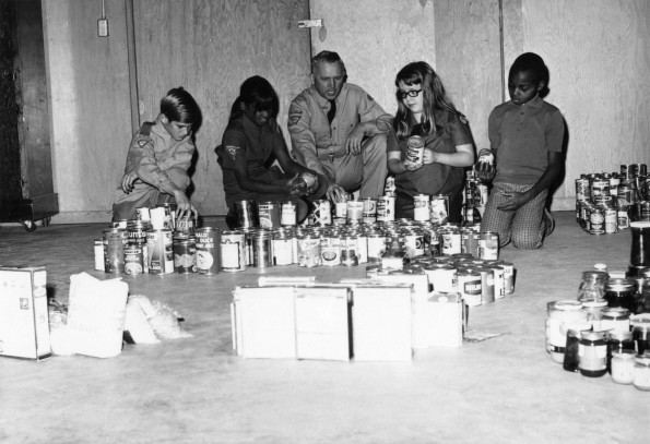 [Pathfinders from Berrien Springs, Michigan organizing food gathered during the annual Thanksgiving food drive]