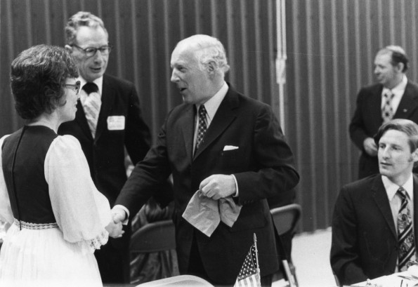 [Elsie Buck shakes hands at 1976 alumni homecoming weekend]