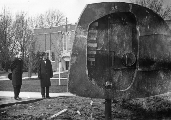 [Faculty of Andrews University admiring a sculpture donated by the class of 1966]