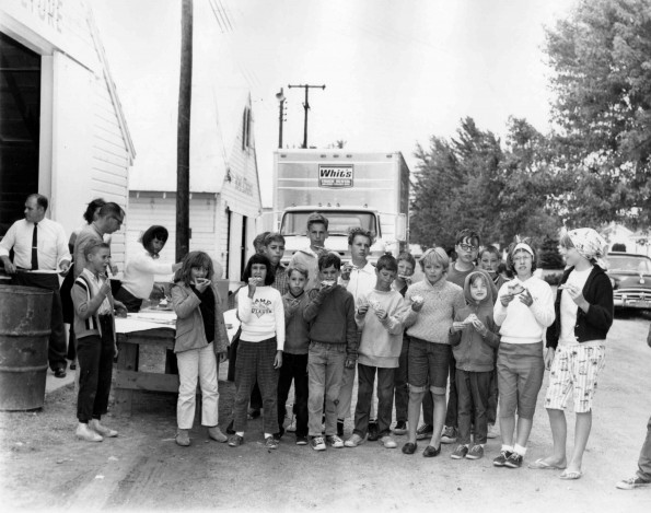 [Children posing for a picture with their pizza]
