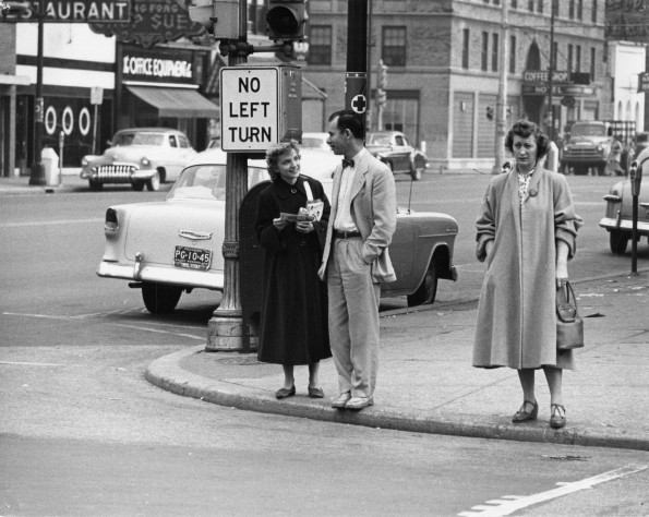 [June Robbins passing out ingathering pamphlets downtown]