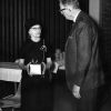 Mrs. G. R. Fattic (Andrews University alumnus) recieves a gift from Horace Shaw