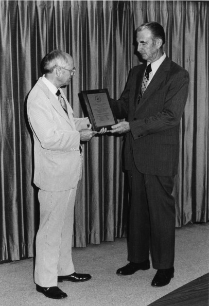 [Edward C. Banks receives an award recognizing his educational work in the area of evangelism]