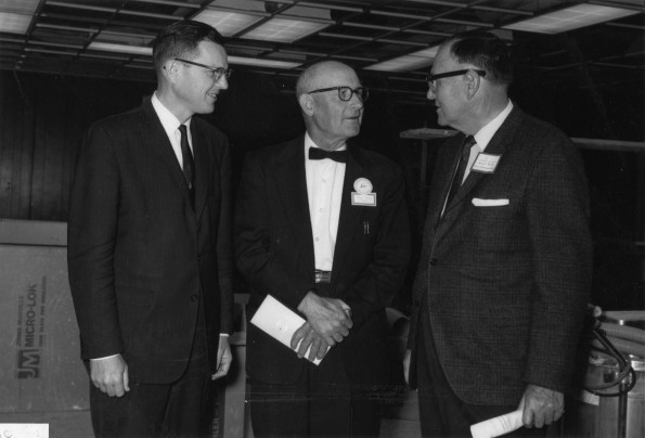 Jere D. Smith, vice chair of the Andrews University Board, and Warren Johns chat with alumni Fred Fund at Andrews University Homecoming