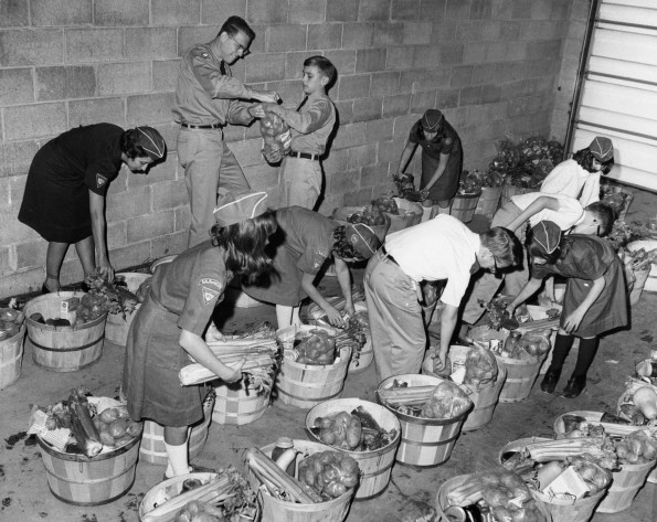 [Pathfinders from Berrien Springs, Michigan organizing food collected from the Thanksgiving food drive]