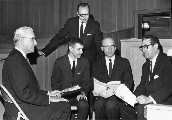 [A group of leaders discussing the hymn festival to be held at Pioneer Memorial Church]