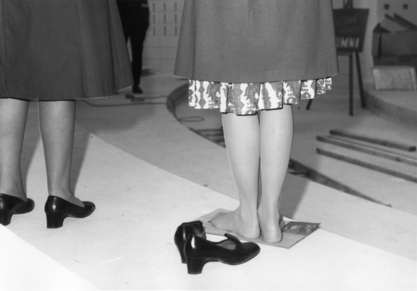 [A lady resting her tired feet during a tour of the Science Complex during the Andrews University's alumni homecoming weekend, 1972]