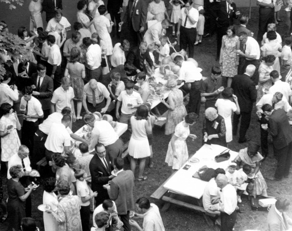 Andrews University alumni having watermelon at the Michigan Camp Meeting