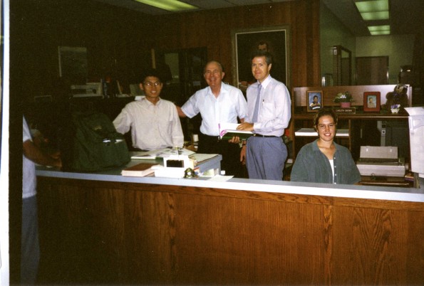 [Jim Ford and employoees standing in the Andrews University Heritage Center]