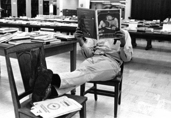 [Charles Satterfield reading in the James White Library]