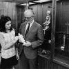 [Siegfried Horn showing Debbie Boyer a figurine in the Andrews University Archaeological Museum]