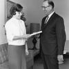 [Linda Boothby receiving a package from Albert Bauer for ingathering]