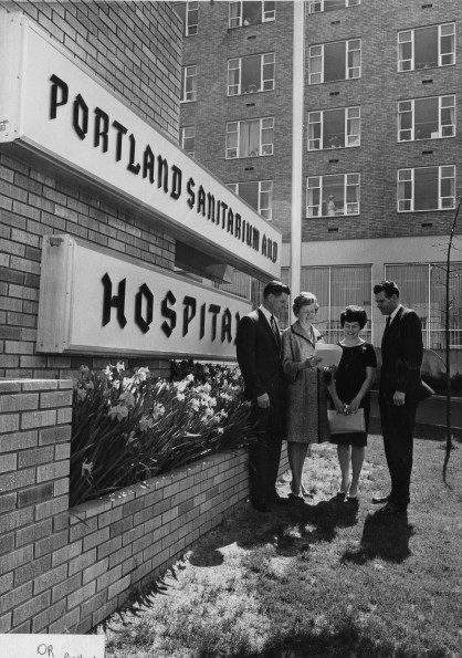 Andrews University alumni Oregon Chapter officers gather outside of Potland Adventist Hospital