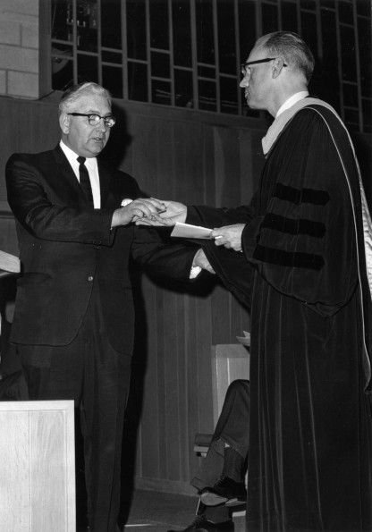 [C. Warren Becker receives organ keys from E.A. Morel ]