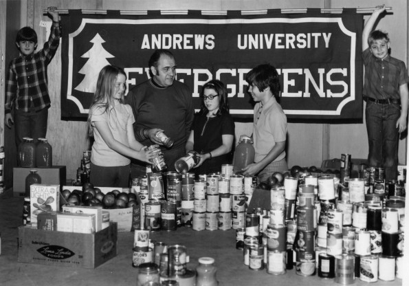[The Evergreens of Berrien Springs, Michigan with food collected from the annual Thanksgiving food drive]
