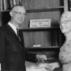[Mrs. Piper presenting a check to Leonard Hill during the 1972 Andrews University alumni homecoming weekend]