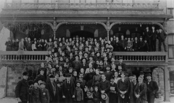 Battle Creek College West Hall entrance with a large group